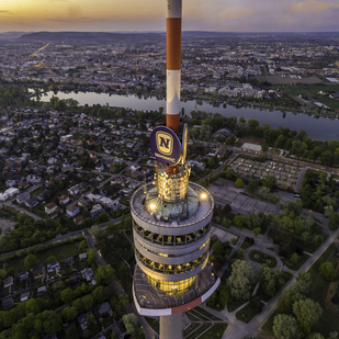 Exterior view of the Danube Tower at dusk